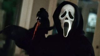 Ghostface holds a bloody knife in his right hand in Scream 1, one of the new Max movies for October 2023